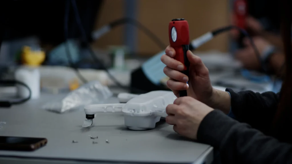 Precision assembly and testing of drone components in a professional workshop.